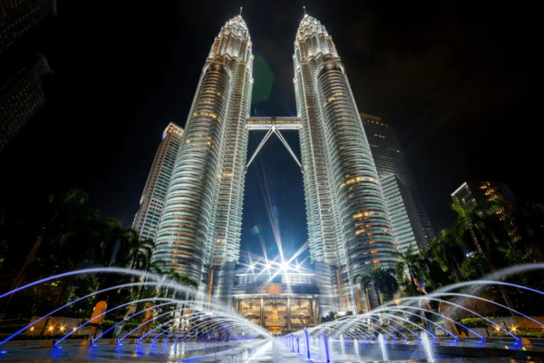 Petronas Twin Towers illuminated at night in Kuala Lumpur