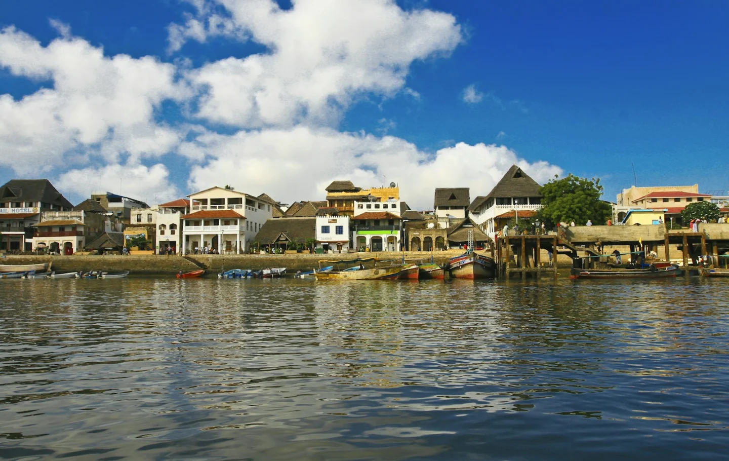 Traditional buildings and boats along the waterfront in Lamu, Kenya
