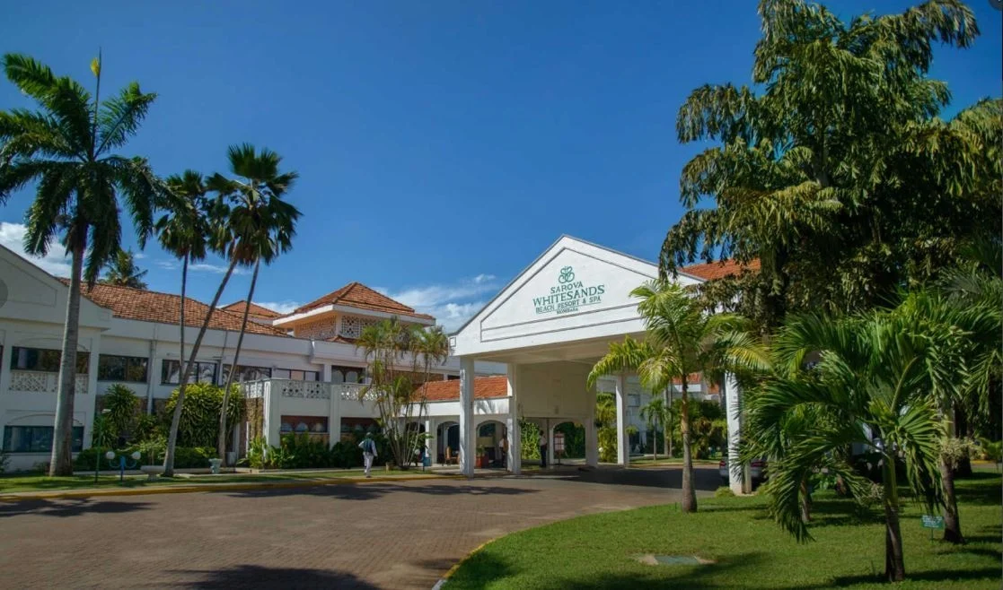 Palm-lined entrance to the resort at Sarova Whitesands Beach Resort & Spa