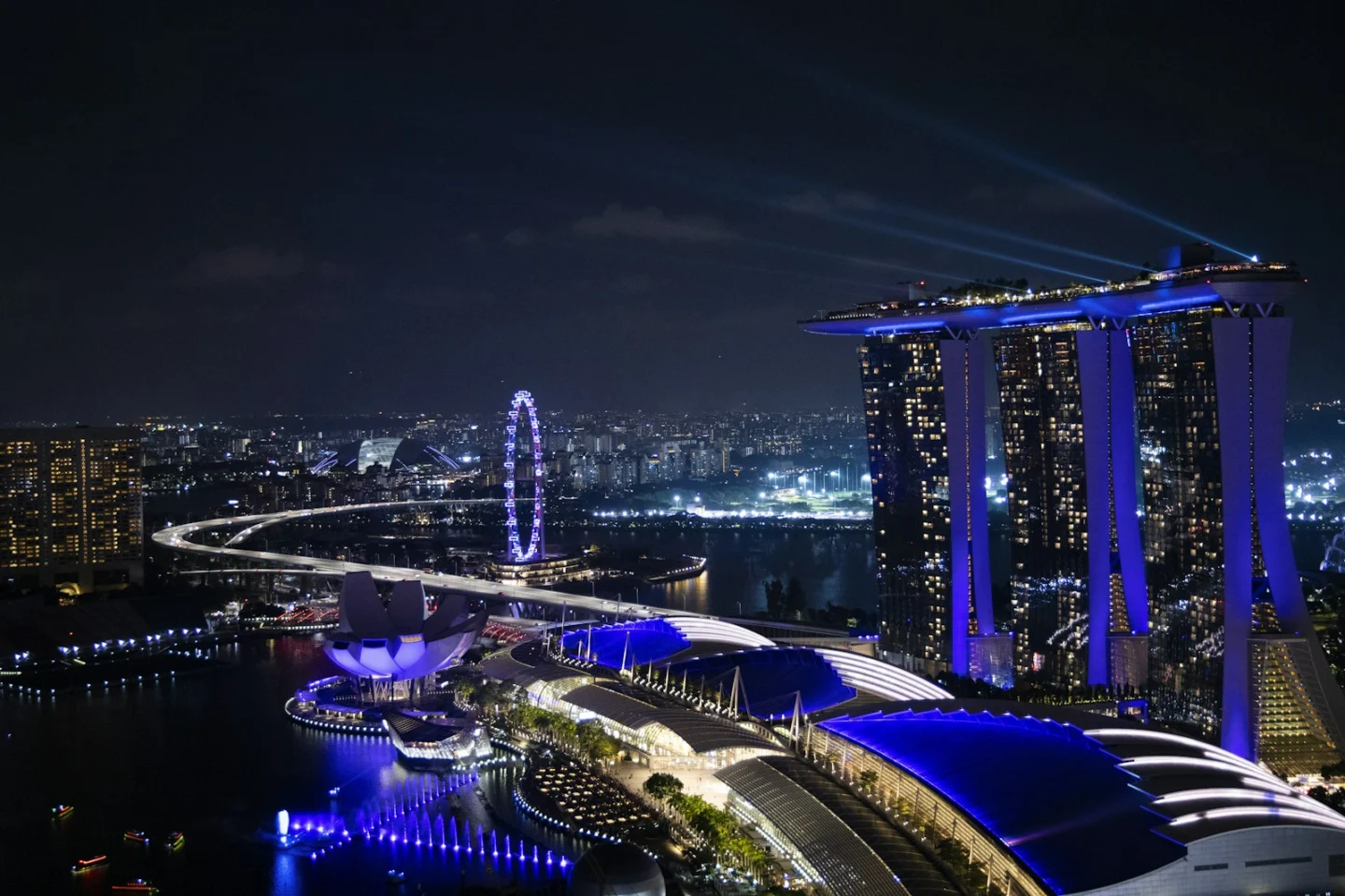 Marina Bay Sands and the illuminated Singapore waterfront at night