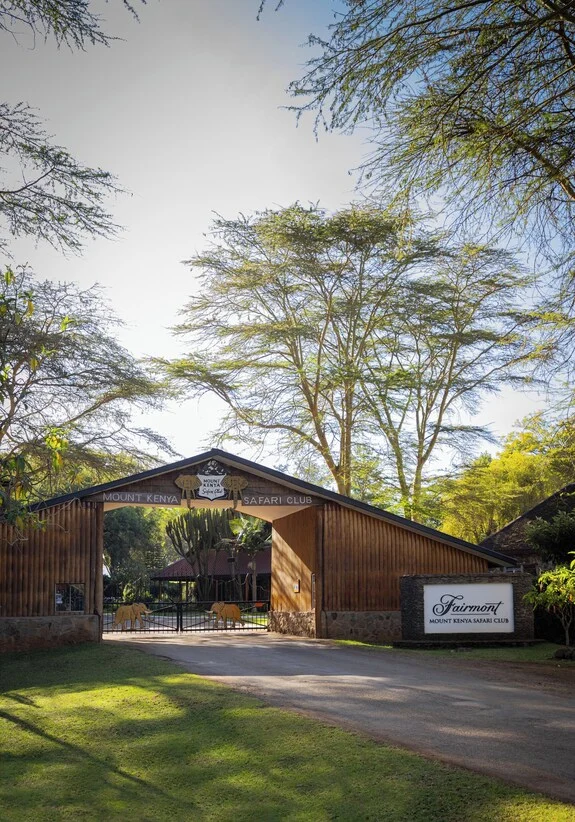 Tree-lined entrance to the safari club at Fairmont Mount Kenya Safari Club