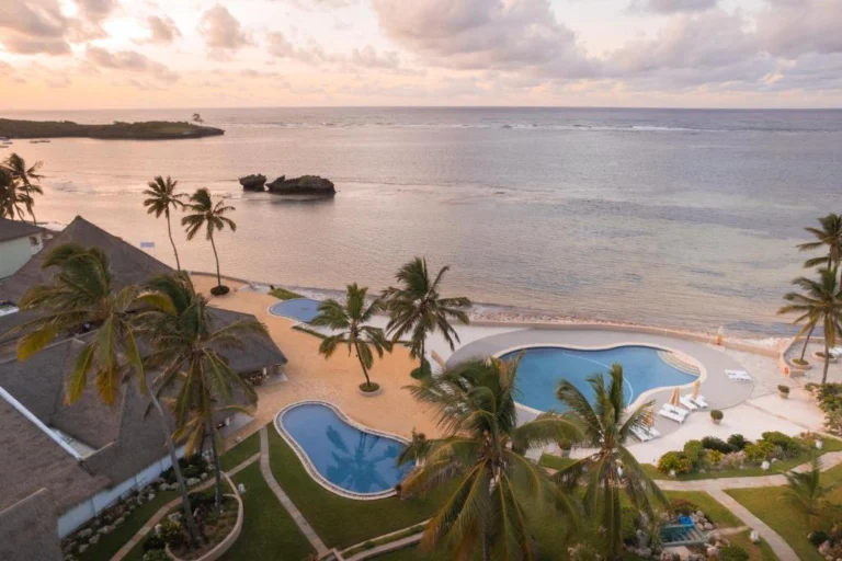 Coastal resort pools and palm trees at Hemingways Watamu